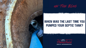 Technician pumping a residential septic tank during routine maintenance